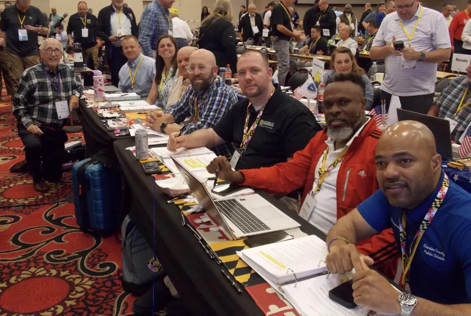 Group of people at a conference table.